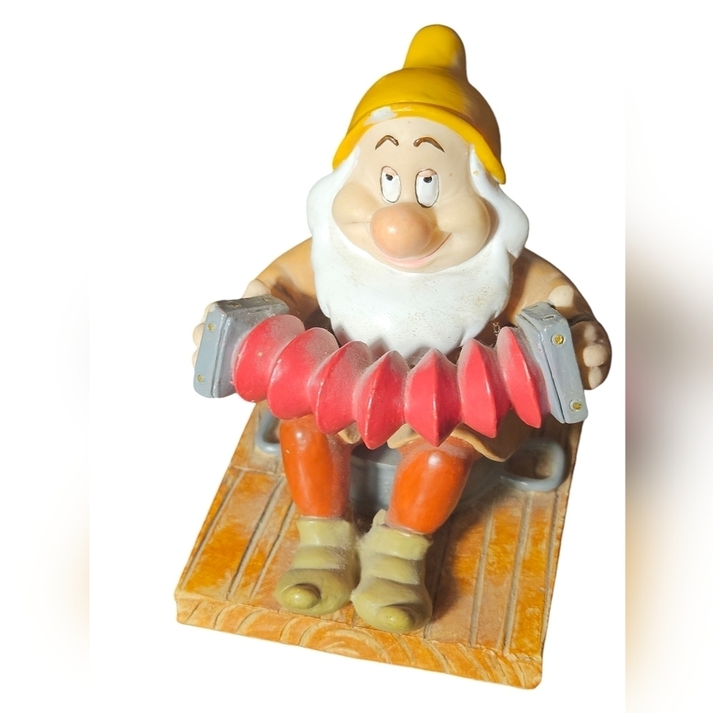Sneezy figurine is one of the lovable Dwarfs from Snow White.